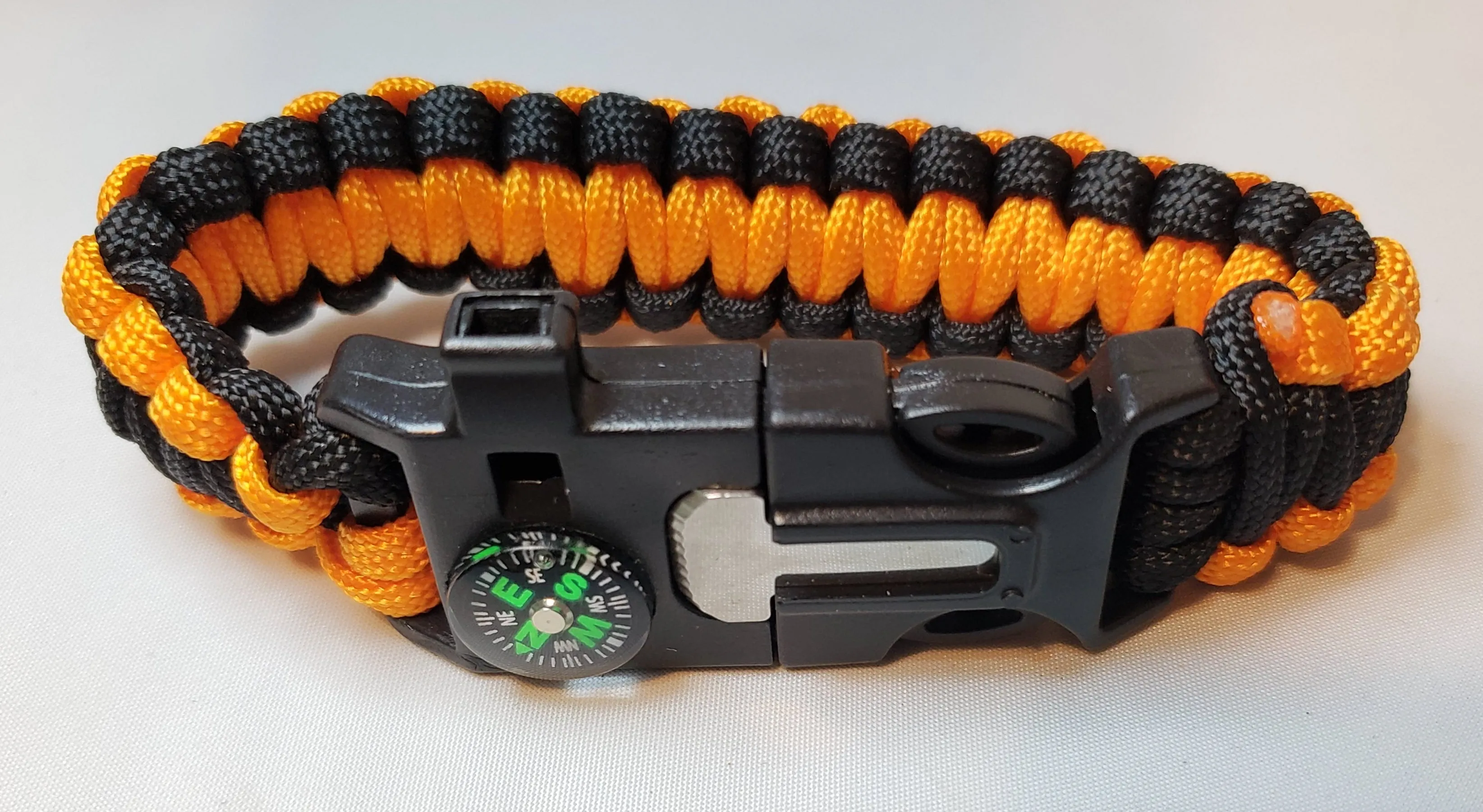 SURVIVAL BRACELET. 5 in 1 with Paracord, Compass, Fire Starter, Whistle & Scraper/Knife. 8.5" in various colors 